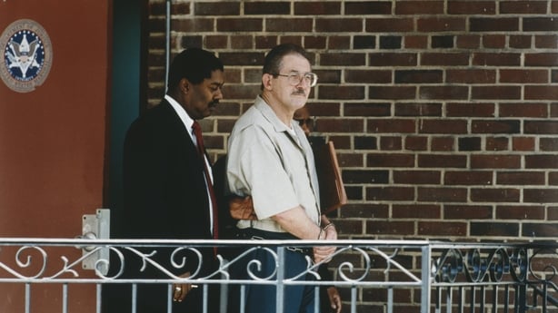 American former CIA counterintelligence officer and Soviet spy Aldrich Ames (right) leaves the courthouse after receiving a life sentence, Washington DC