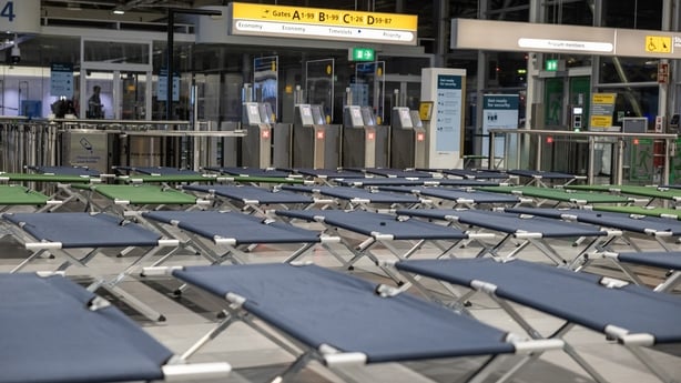Camp beds set up an an airport