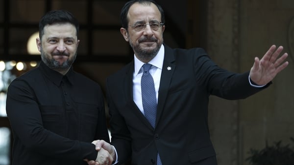 Volodymyr Zelensky, shakes hands with his Cypriot counterpart Nikos Christodoulides