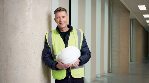 Dermot Bannon holding hard hat