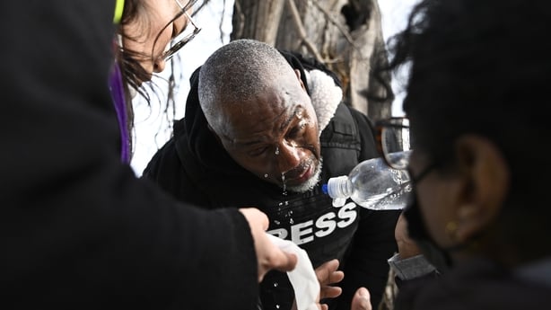 A journalist treated after being exposed to a chemical irritant following a suspected shooting by an ICE agent Minneapolis, Minnesota