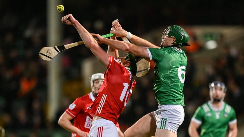 Cork's Colin O'Brien and William O'Donoghue of Limerick contest a dropping ball