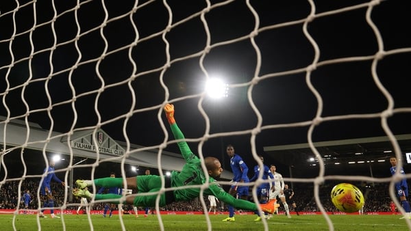 Chelsea's Spanish goalkeeper #01 Robert Sanchez dives but concedes a second goal, by Fulham's Welsh midfielder #08 Harry Wilson, during the English Premier League football match between Fulham and Chelsea at Craven Cottage in London on January 7, 2026