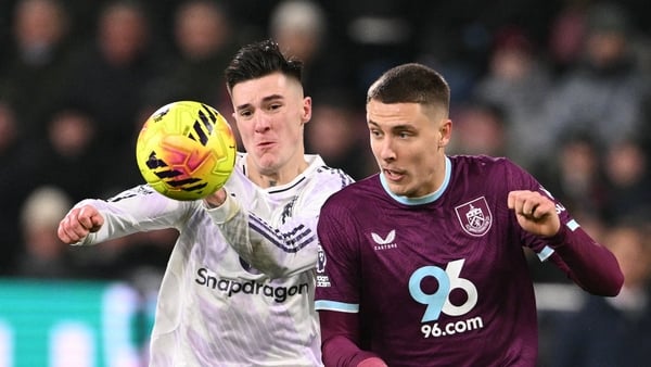 Manchester United's Slovenian striker #30 Benjamin Sesko (L) tangles with Burnley's French defender #05 Maxime Esteve (R) during the English Premier League football match between Burnley and Manchester United at Turf Moor in Burnley, north-west England on