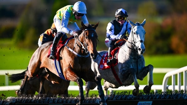 17 November 2025; Eventual winner I'll Sort That, with Declan Queally up, left, and Theflyingking, with Sam Ewing up, who finished second, jump the last 'first time round' in the Bar One Racing For Auction Novice Hurdle at Navan Racecourse in Meath. Photo