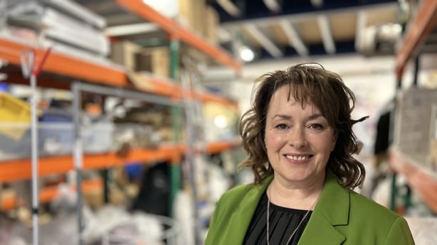 Mary Gamble standing in Barnardos storage unit