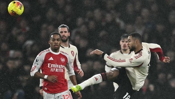 Cody Gakpo miscues a defensive clearance during the English Premier League football match between Arsenal and Liverpool at the Emirates Stadium in London on January 8, 2026.