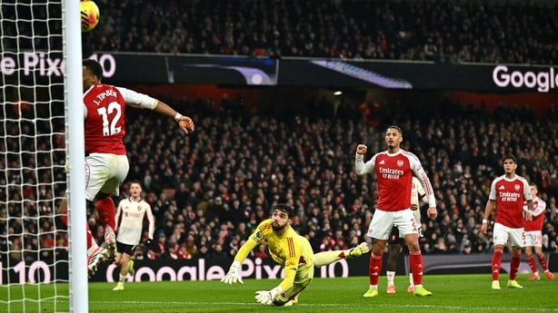 Arsenal's Spanish goalkeeper #01 David Raya (C) looks on as the ball hits the post from an attempted long shot from Liverpool's Northern Irish defender #12 Conor Bradley after a mix up in the Arsenal defence during the English Premier League football match between Arsenal and Liverpool at the Emirat