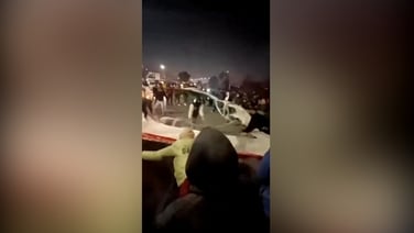 Iranians rip national flag in half in protest against economic hardship