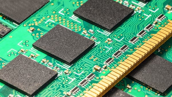 A view of a group of computer PC DRAM memory chips on a circuit board