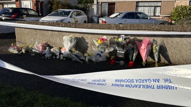 Flowers are left outside a house in Clondalkin, Dublin where the body of 12-year-old Oisin O'Reilly was found