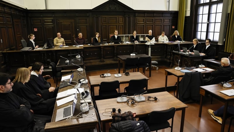 Members of the court sitting in the court room on the first day of the 'White Tiger' trial in Hamburg, Germany