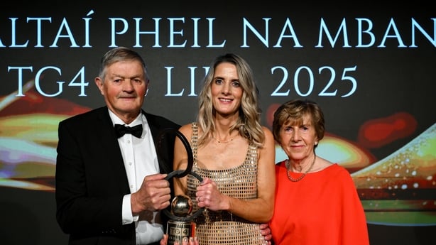 Former Cork footballer Juliet Murphy, winner of the 2025 LGFA Hall of Fame award, with her parents Michael and Mary