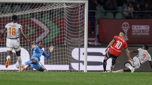 ypt's forward #10 Mohamed Salah scores a goal in front of Ivory Coast's goalkeeper #01 Yahia Fofana during the Africa Cup of Nations (CAN) quarter-final football match between Egypt and Ivory Coast at the Grand stadium in Agadir on January 10