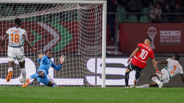 ypt's forward #10 Mohamed Salah scores a goal in front of Ivory Coast's goalkeeper #01 Yahia Fofana during the Africa Cup of Nations (CAN) quarter-final football match between Egypt and Ivory Coast at the Grand stadium in Agadir on January 10