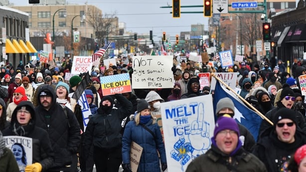 Protesters hold signs as they march from Powderhorn Park in Minneapolis against Immigration and Customs Enforcement (ICE) and the fatal shooting of Renee Good by an ICE agent, calling on federal authorities to leave the city and demand accountability, in Minneapolis, Minnesota, on January 10, 2026. 