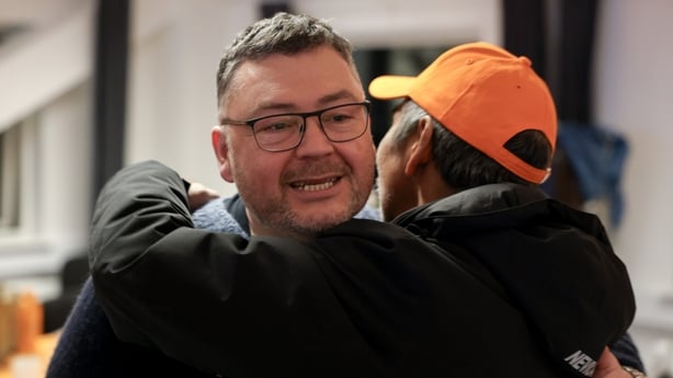Pele Broberg, the leader of the pro-independence Naleraq party, watches votes being counted