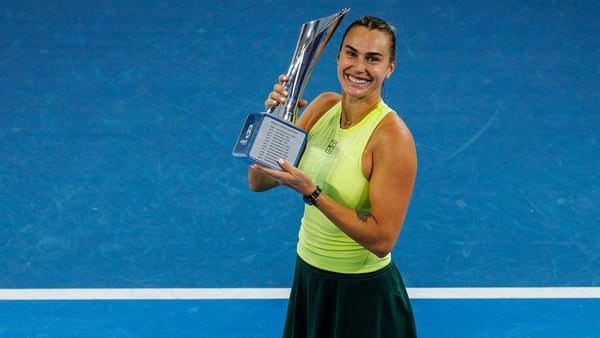 Aryna Sabalenka of Belarus celebrates with the trophy after winning the women's singles final against Marta Kostyuk of Ukraine at the Brisbane International tennis tournament in Brisbane on January 11, 2026