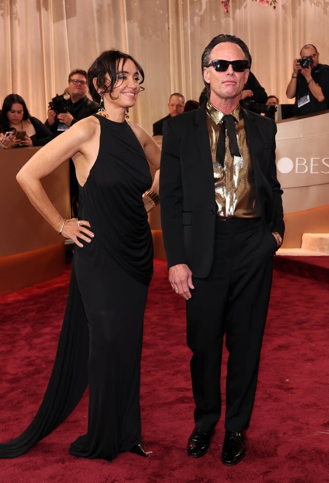 Nadia Conners and Walton Goggins attend the 83rd Annual Golden Globe Awards