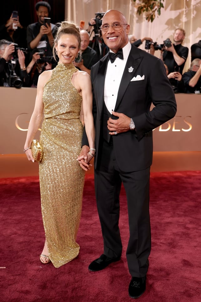 Lauren Hashian and Dwayne Johnson attend the 83rd annual Golden Globe Awards