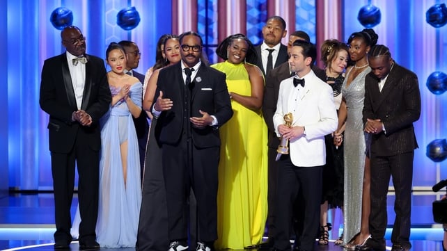Director Ryan Coogler and the cast of Sinners accept the Golden Globe for Cinematic & Box Office Achievement