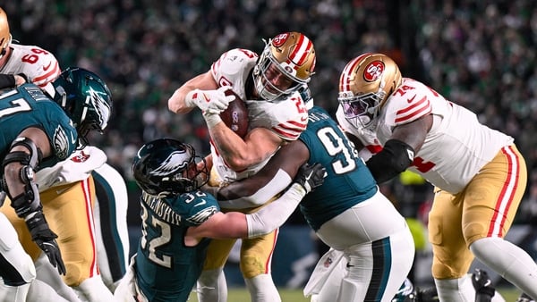 San Francisco 49ers running back Christian McCaffrey pushes through the Eagles defence