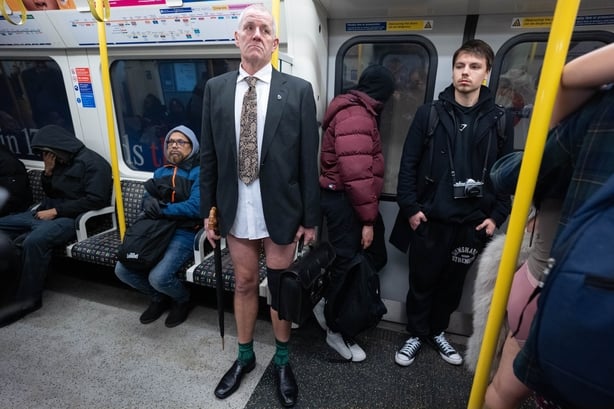 People take part in the No Trousers on Tube Ride event on the London Underground