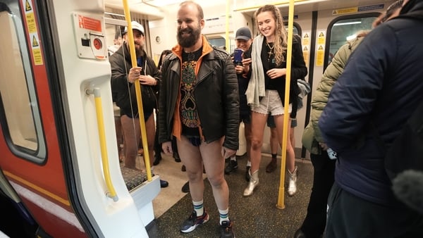 People take part in the No Trousers on Tube Ride event on the London Underground