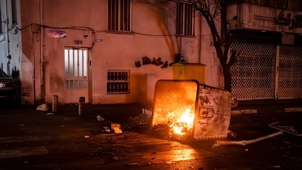 A bin on fire during protest in Tehran, Iran