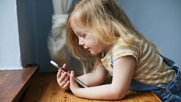 Toddler girl using a smartphone