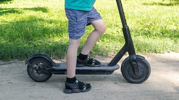 child on e scooter