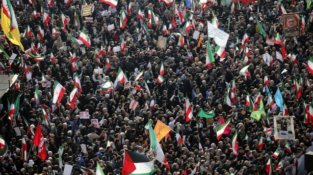 People attend a rally in the Iranian capital Tehran against anti-government protests