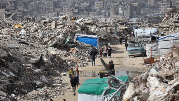 Palestinians struggle to carry on with daily life amid the rubble left by Israeli attacks in Jabalia, Gaza