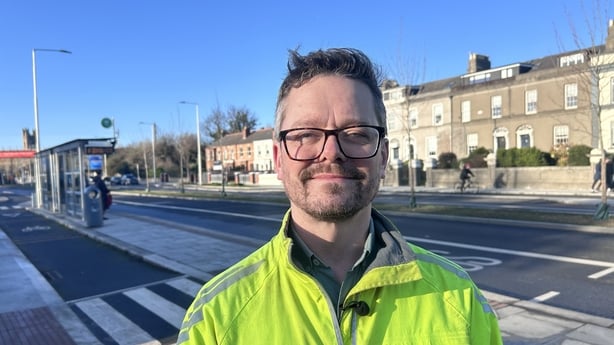 Cllr Karl Stanley standing at one of Dublin's cycle lanes