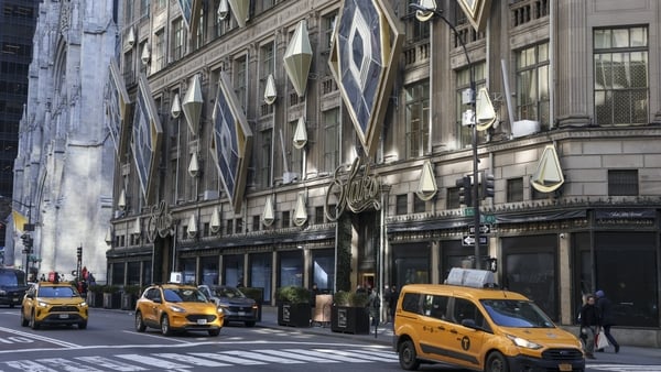 Exterior view of the Saks Fifth Avenue department store in New York with yellow cabs outside