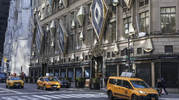 Exterior view of the Saks Fifth Avenue department store in New York with yellow cabs outside