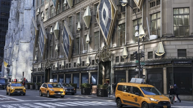 Exterior view of the Saks Fifth Avenue department store in New York with yellow cabs outside