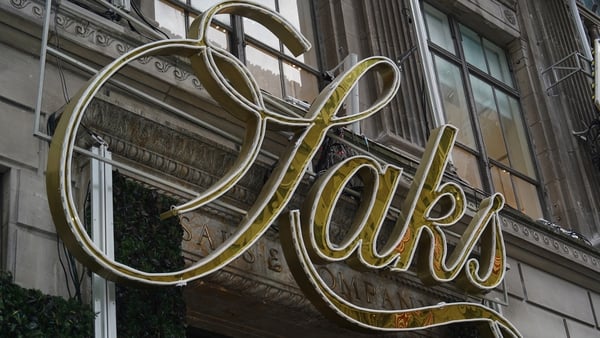 Signage outside the Saks Fifth Avenue flagship store in New York