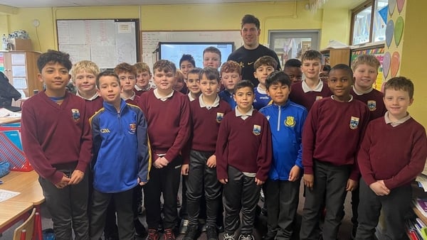 oughrea Hurler Joe Mooney with his 3rd and 4th class students at St Brendan Boys NS