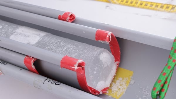 An ice core sample lies on a table exposed to the sun and preventing the formation of new ice. (Photo by Sean Gallup/Getty Images)