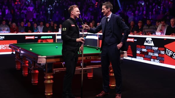 LONDON, ENGLAND - JANUARY 14: Judd Trump of England is interviewed by Rob Walker, Reporter and Commentator, after victory in his first round match against Ding Junhui of China on day four of the Johnstone's Paint Masters at Alexandra Palace on January 14,