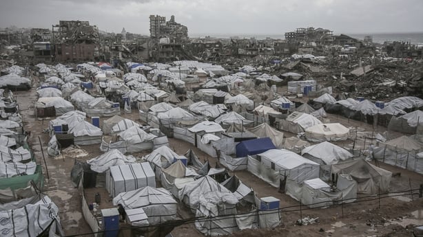A photograph shows tent shelters housing displaced Palestinian families set up along the shore in Gaza City as strong winter winds sweep the Palestinian enclave on January 13, 2026. A fragile ceasefire has been in place since October, following a deadly war waged by Israel in response to Hamas's unp