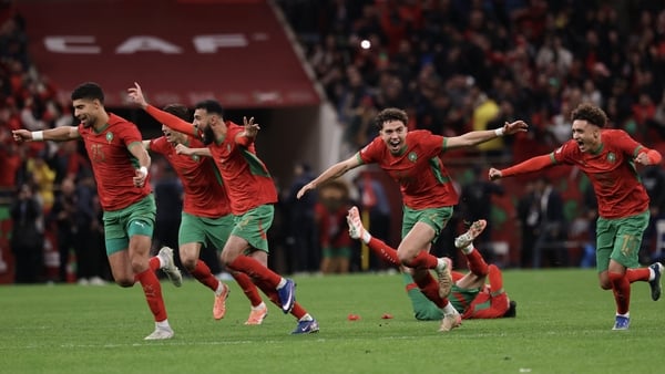 Morocco's players celebrate after winning the Africa Cup of Nations (CAN) semi-final football match between Nigeria and Morocco