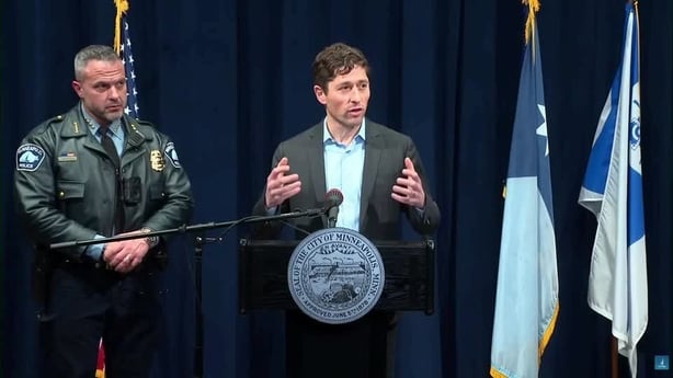 Mayor Jacob Frey speaking at a podium