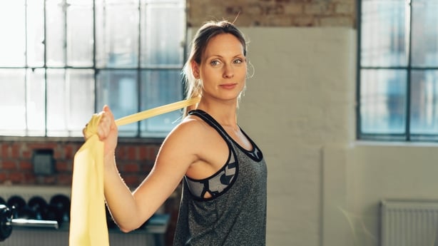 woman working out with gym bands
