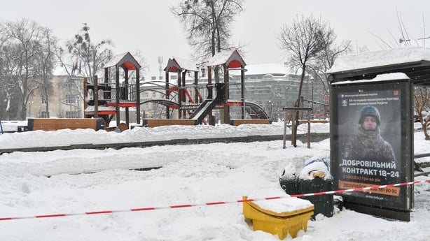 Red-and-white warning tape surround playground where a Russian drone fell earlier this week