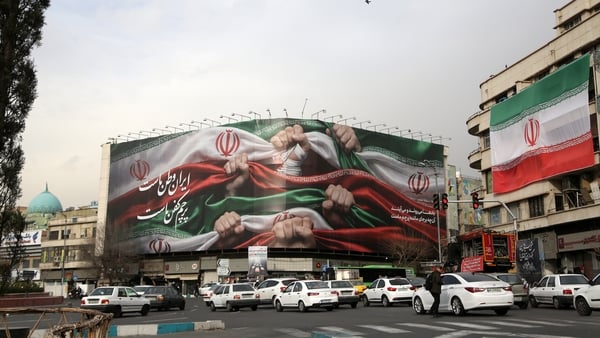 TEHRAN, IRAN - JANUARY 15: A view of giant banner, featuring an image of the Iranian flag and the slogan reading 'Iran is our homeland, the flag is our shroud' at Enghelab Square in the capital Tehran, Iran on January 15, 2026. Iran has been rocked by wav