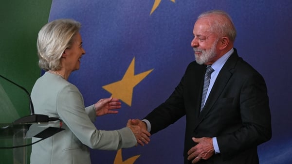 President of the European Commission Ursula von der Leyen and Brazil's President Luiz Inacio Lula da Silva shake hands