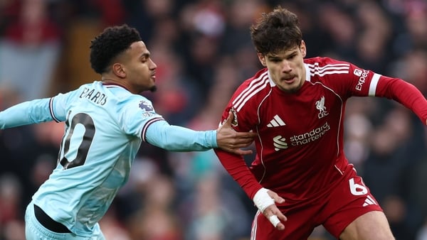 Milos Kerkez of Liverpool is challenged by Marcus Edwards of Burnley during the Premier League match between Liverpool and Burnley at Anfield on January 17, 2026 in Liverpool, England.