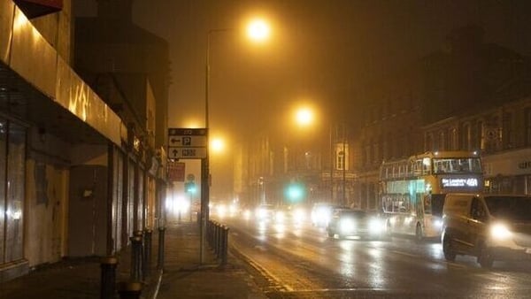 Commuters drive through heavy fog in Dublin in 2022
